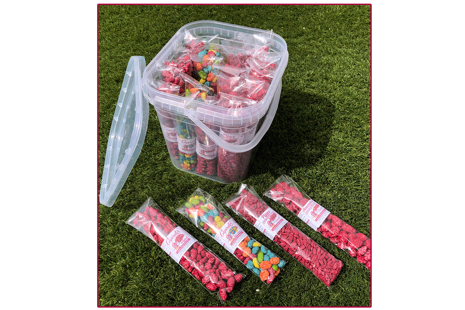 Cubo surtido de 24 bolsas de garrapiñados artesanales con cacahuetes, almendras y pipas
